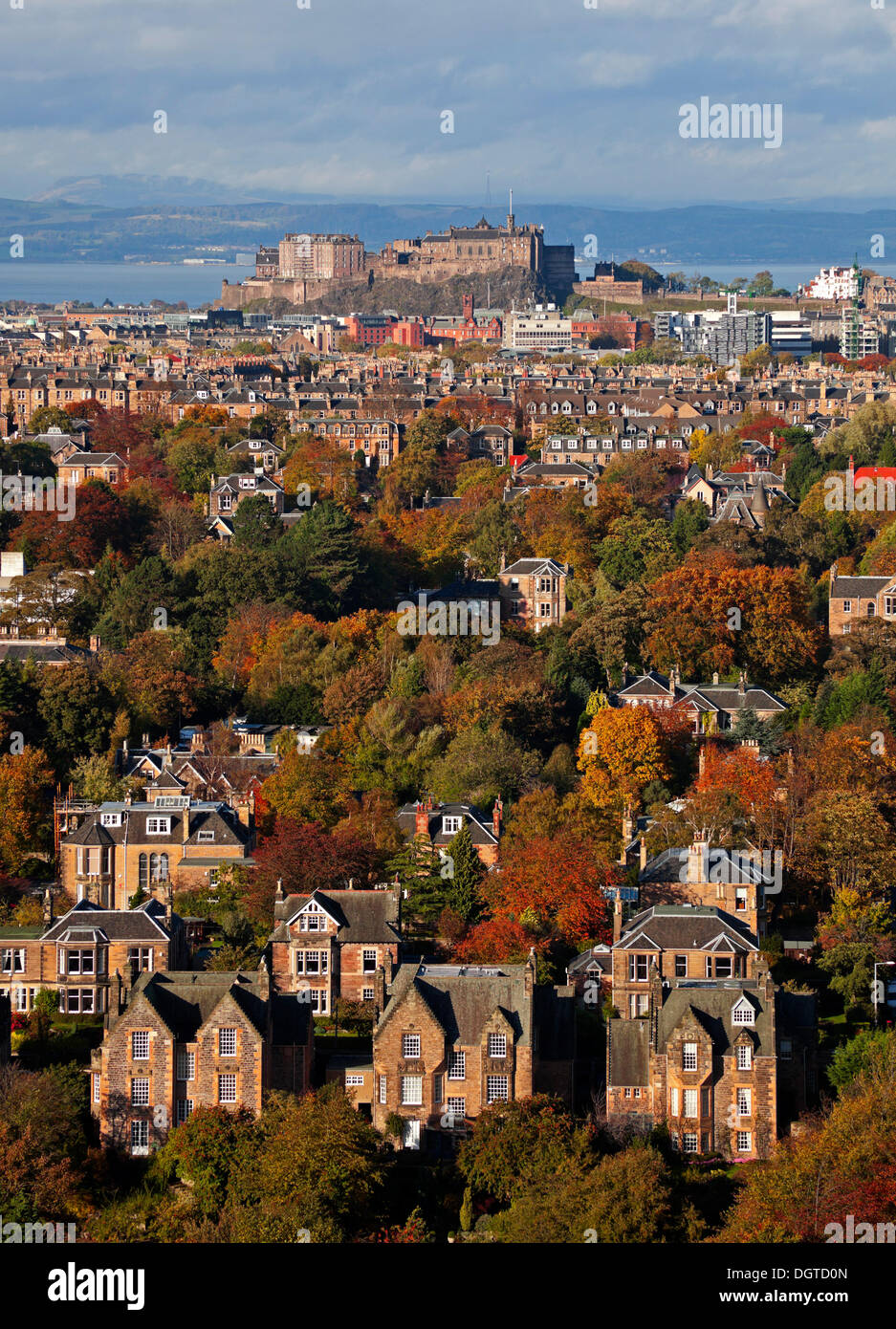 Edinburgh, Scotland, UK. 25th Oct, 2013. The sun picks out the Autumn colours on the decidious trees of the Scottish capital city. But forecasters are warning that more stormy weather is on its way. Stock Photo