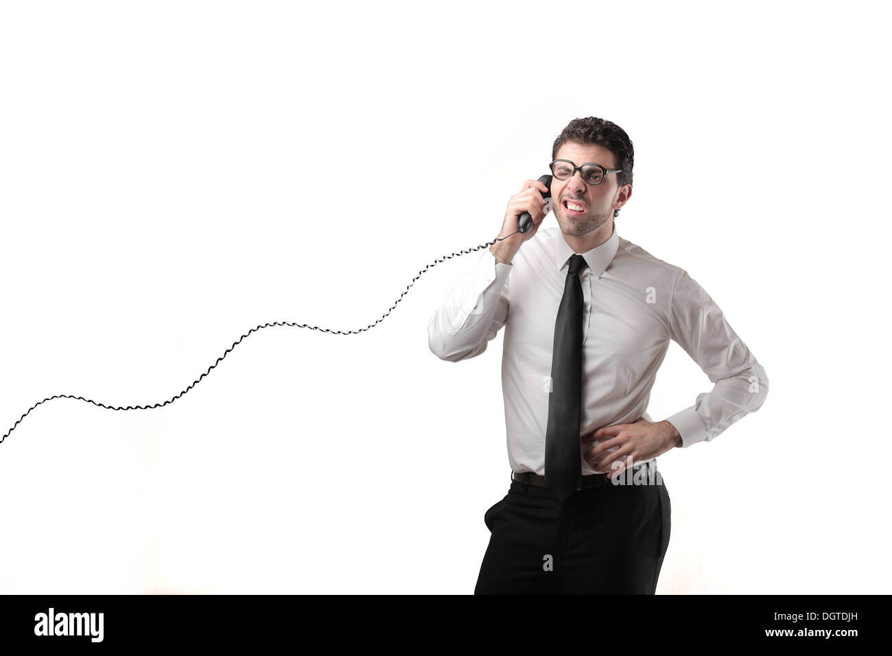Office worker calling someone with a phone Stock Photo