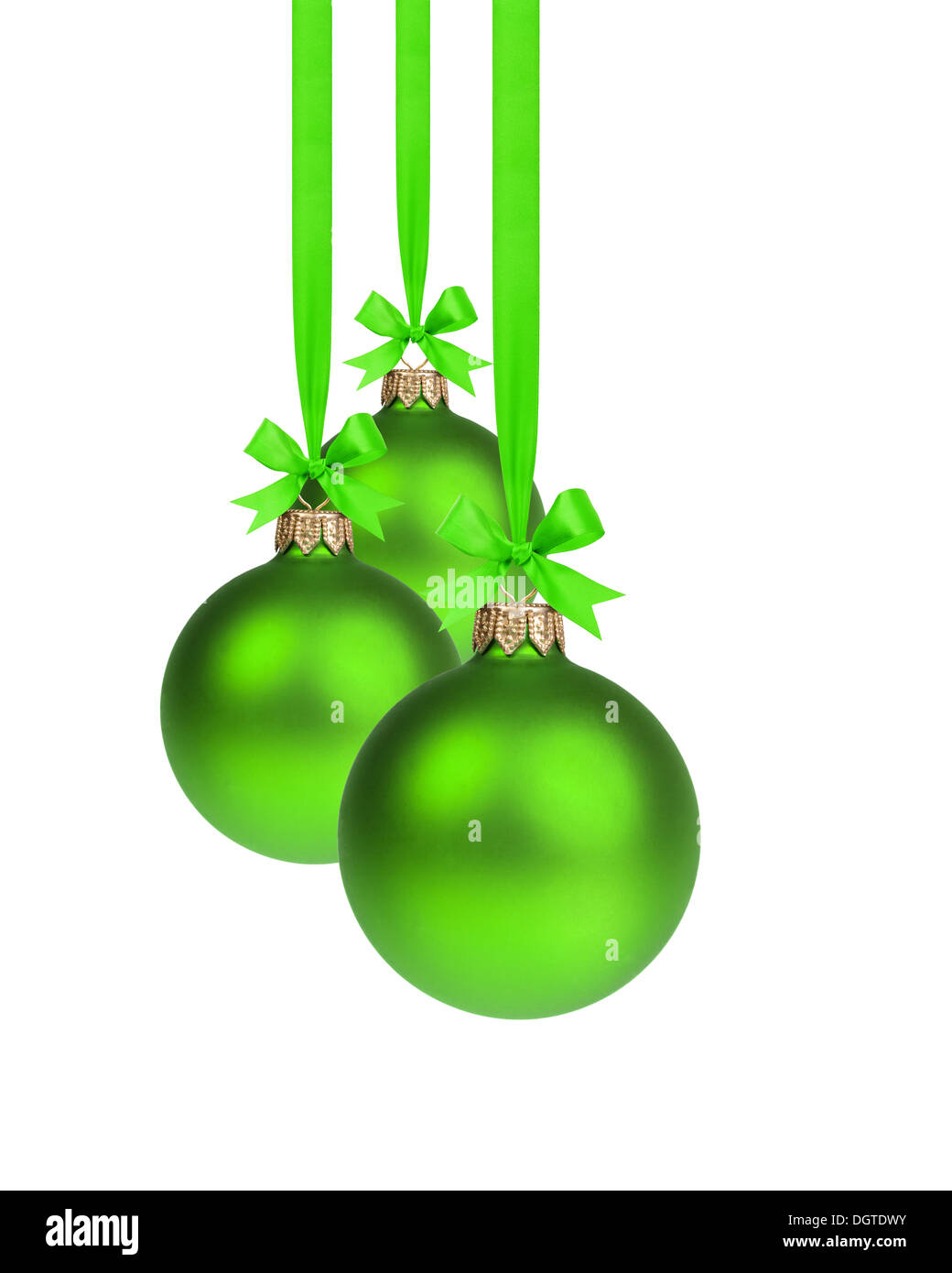 composition from three green christmas balls hanging on ribbon, white ...