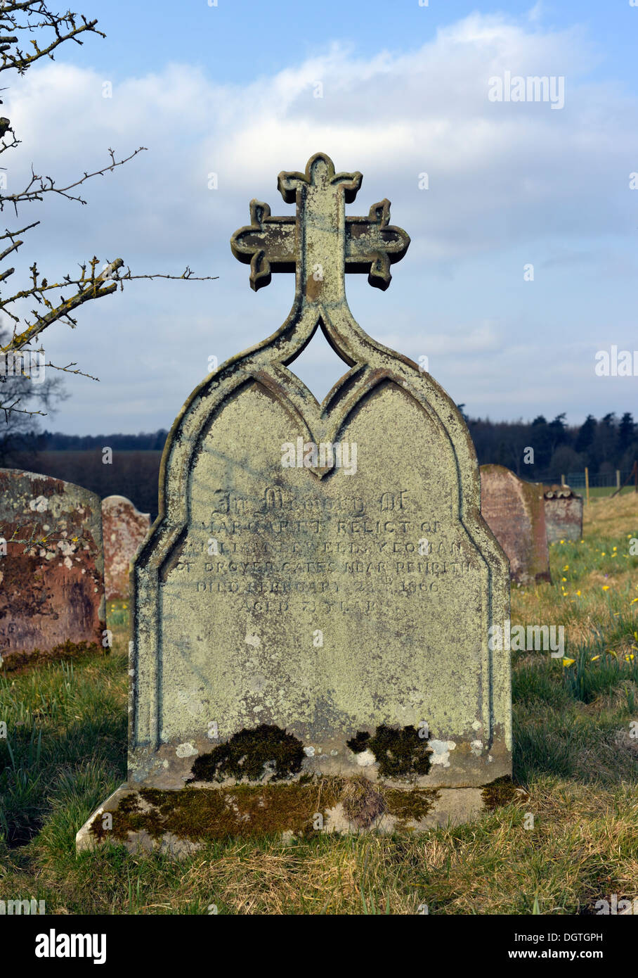 19th.century gravestone with cross. Church of Saint Cuthbert. Edenhall, Cumbria, England, United Kingdom, Europe. Stock Photo