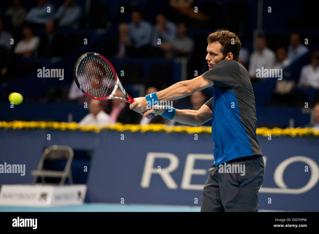 Basel, Switzerland. 25th Oct, 2013. Paul-Henri Mathieu (FRA) hits the ball with a backhand during a match of the quarter finals of the Swiss Indoors at St. Jakobshalle on Friday. Photo: Miroslav Dakov/ Alamy Live News Stock Photo