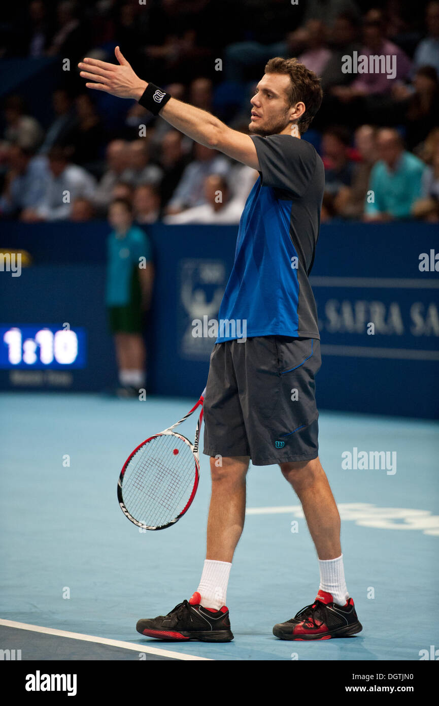 Basel, Switzerland. 25th Oct, 2013. Paul-Henri Mathieu (FRA) protests against people using flash photography during a match of the quarter finals of the Swiss Indoors at St. Jakobshalle on Friday. The argentinian wins the first set. Photo: Miroslav Dakov/ Alamy Live News Stock Photo