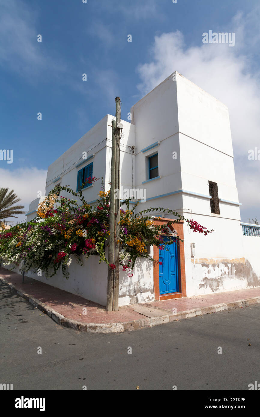 House with blue door in Plaza de Espana in the town of Sidi Ifni, Atlantic coast of Morocco Stock Photo