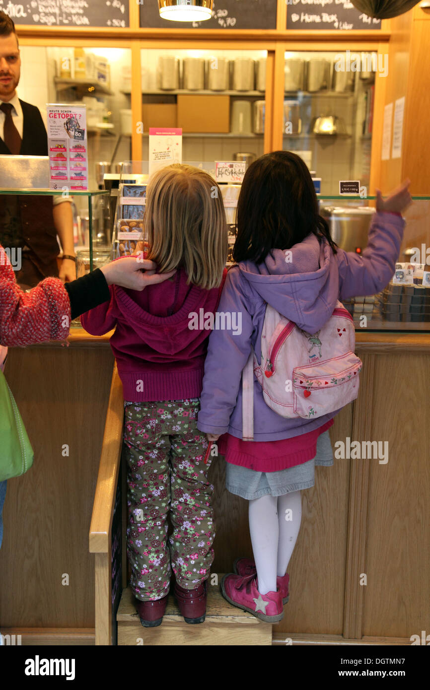 Two little girls in a Berlin sweet shop Stock Photo