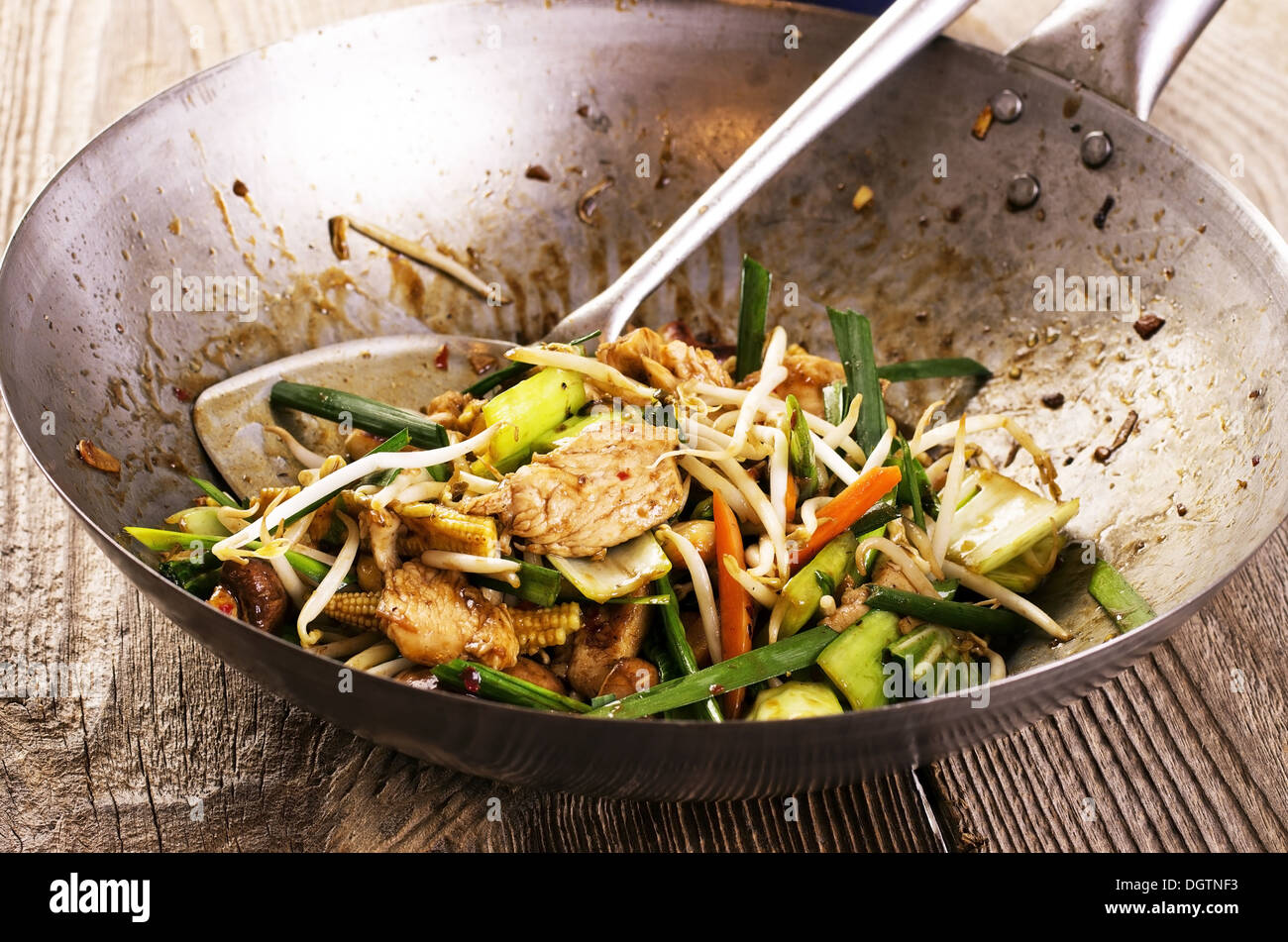chicken with vegetable stir-fried in wok Stock Photo