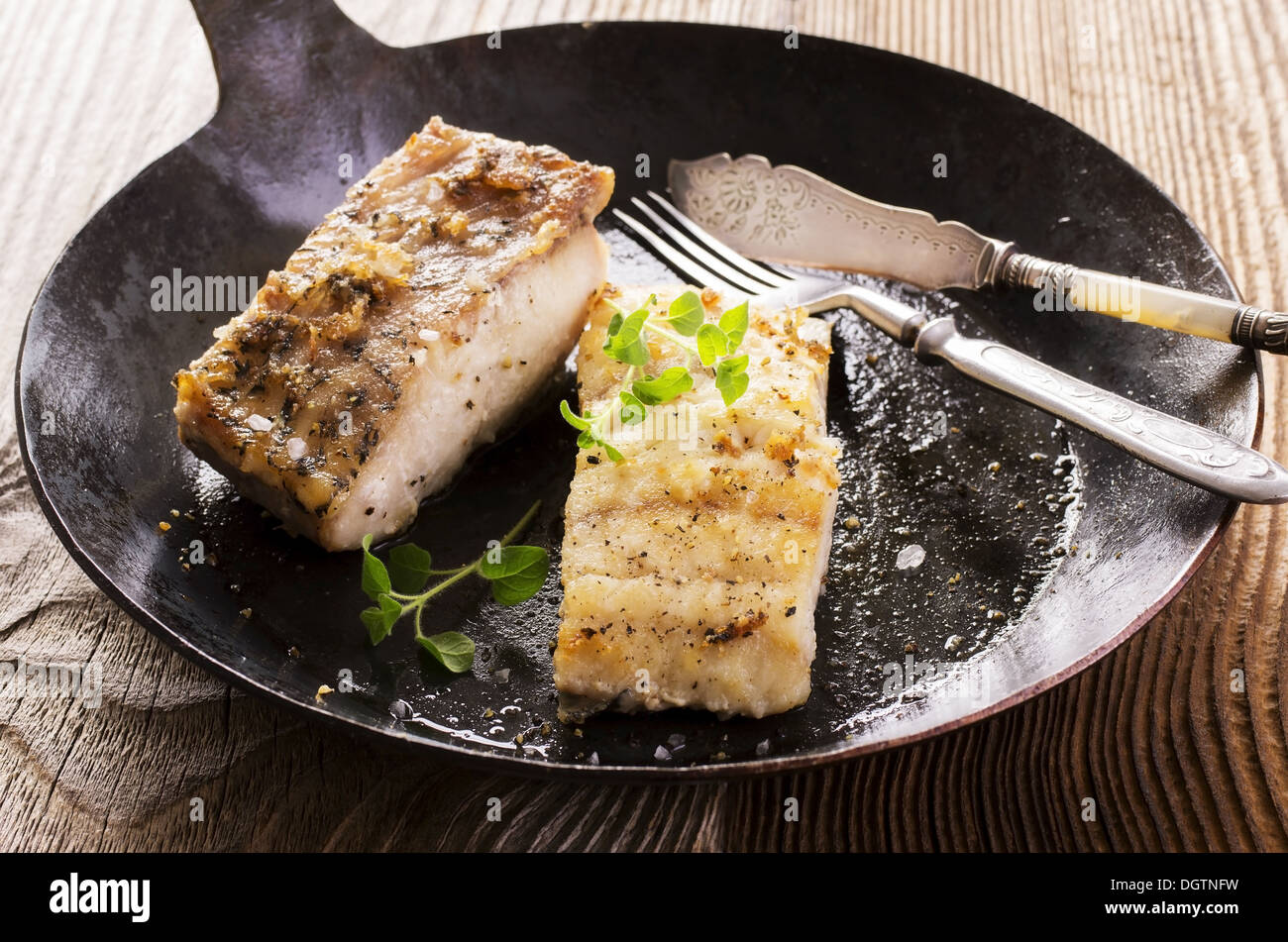 grouper fillet fried in the pan Stock Photo Alamy