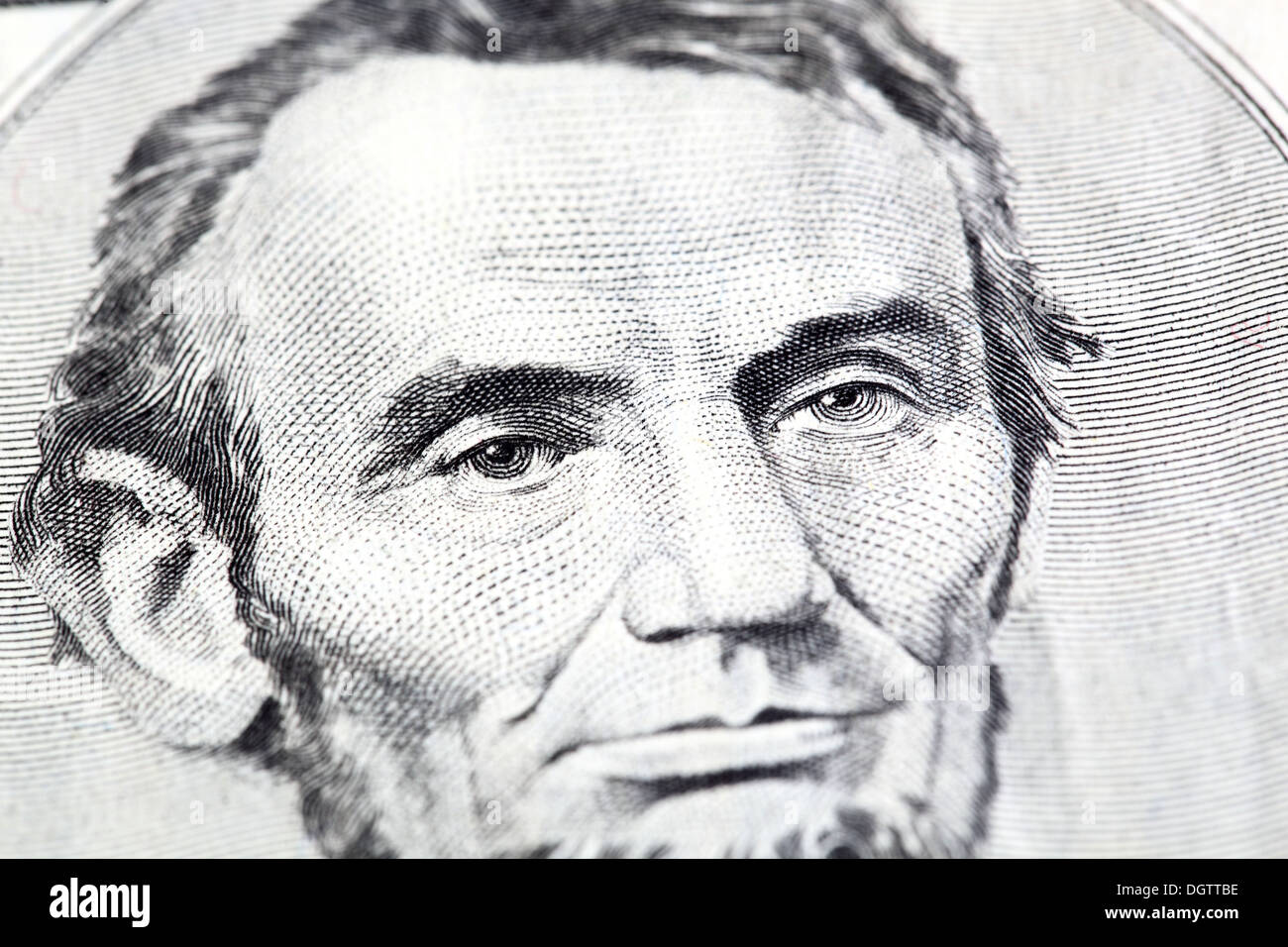 Portrait of Abraham Lincoln in front of the five dollar bill Stock Photo