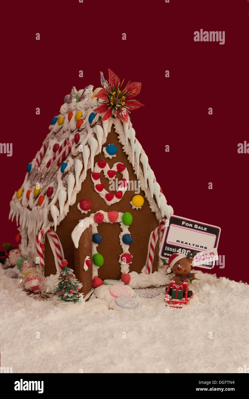 Gingerbread house with real estate "sold" sign Stock Photo Alamy