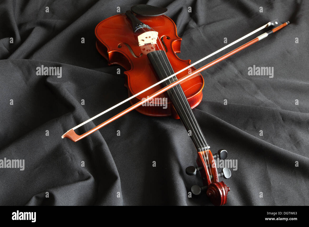 New violin on black fabric Stock Photo Alamy