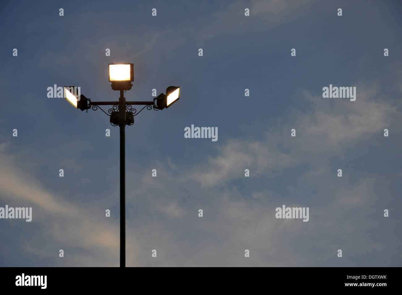 four park light poles in dusk Stock Photo Alamy