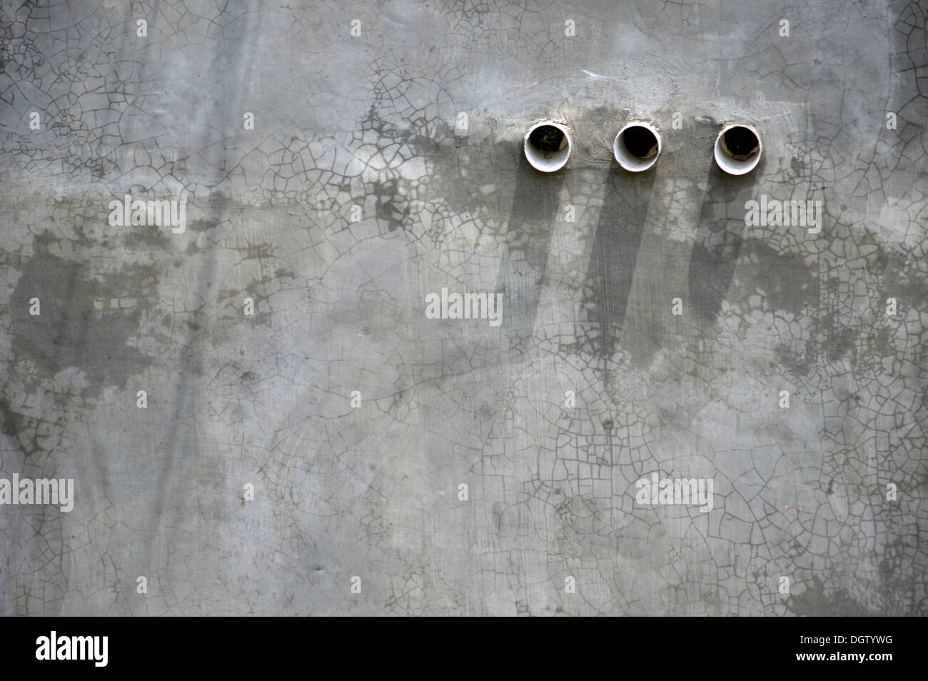 three air holes in the cement wall Stock Photo Alamy
