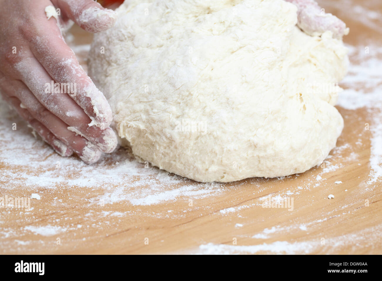 Woman hands knead the dough Stock Photo - Alamy