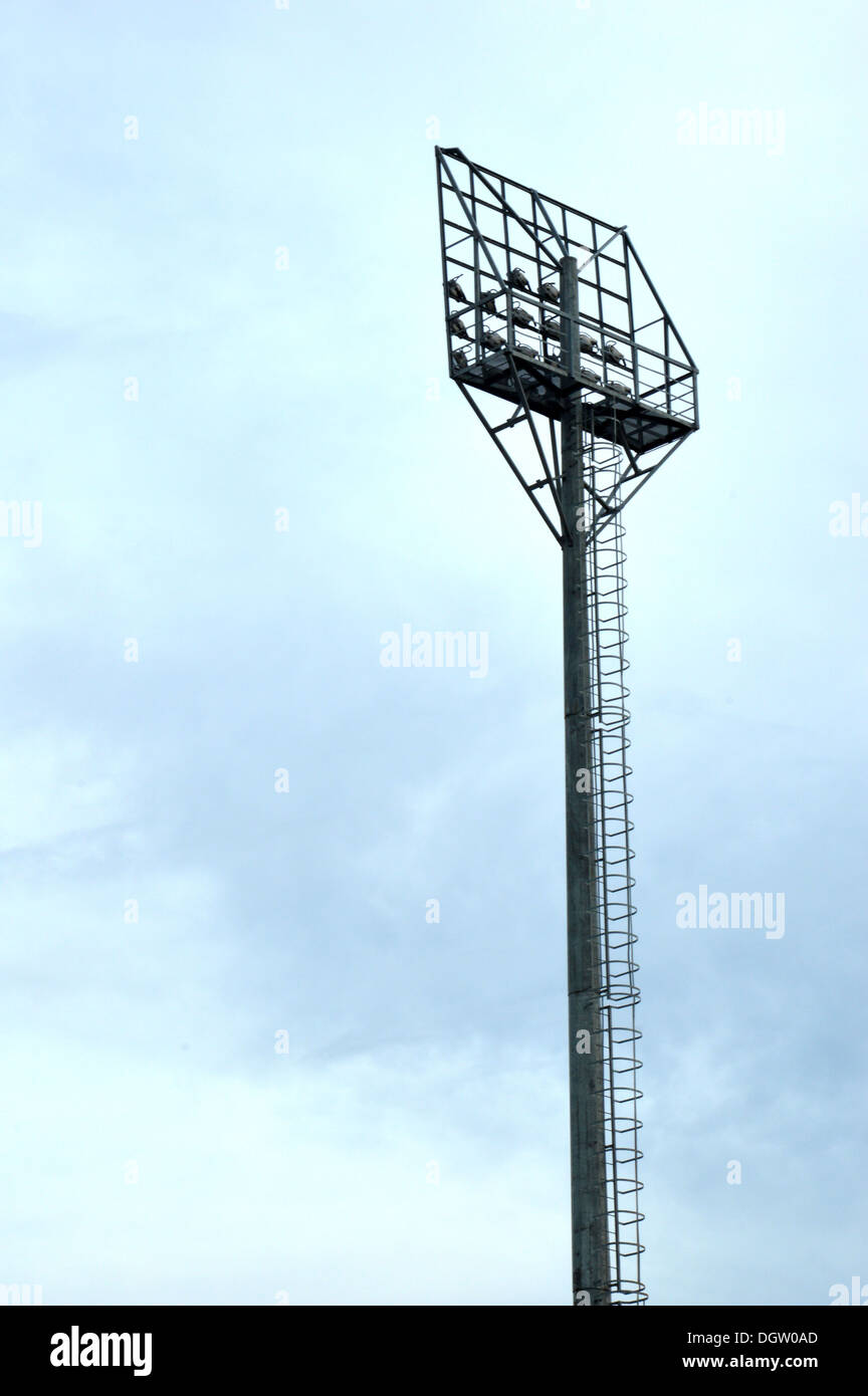 stadium light poles with white clouds and blue sky backgrounds Stock