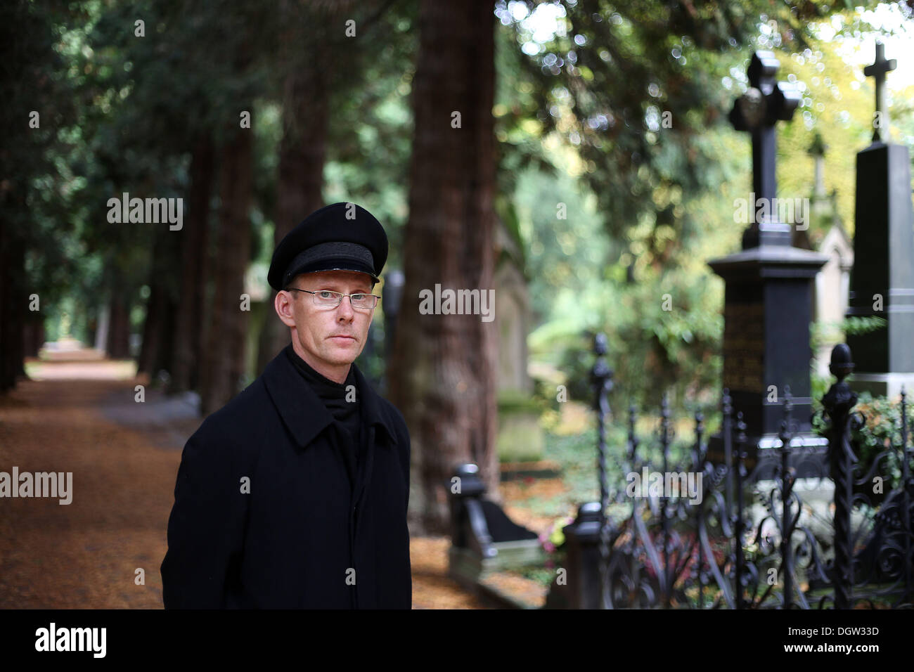 Cologne, Germany. 21st Oct, 2013. The Gravedigger Michael Roth stands on the Melatenfriedhof cemetery in Cologne, Germany, 21 October 2013. Photo: Oliver Berg/dpa/Alamy Live News Stock Photo