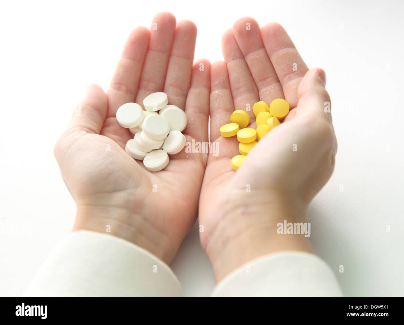 tablets in a child's hand Stock Photo