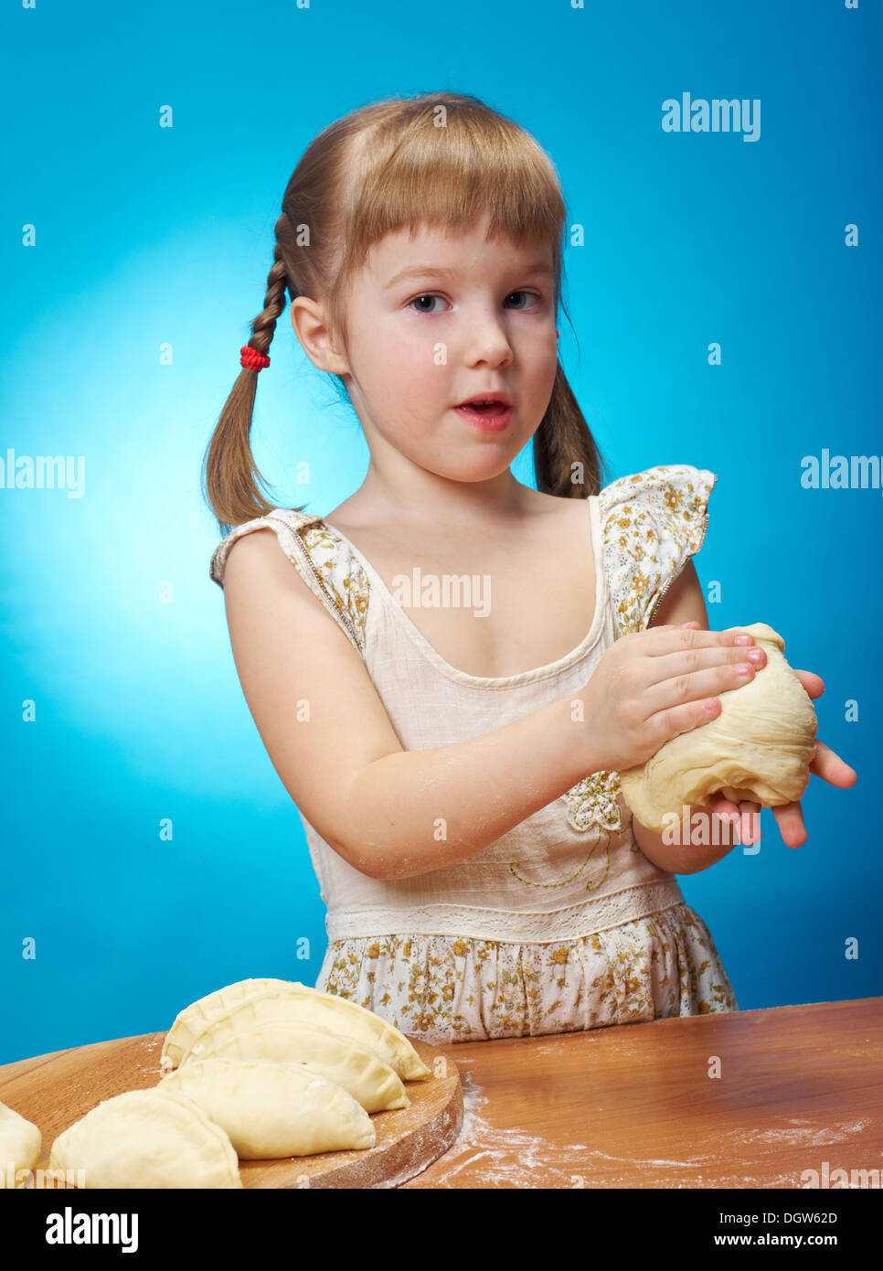 little girl kneading dough Stock Photo Alamy
