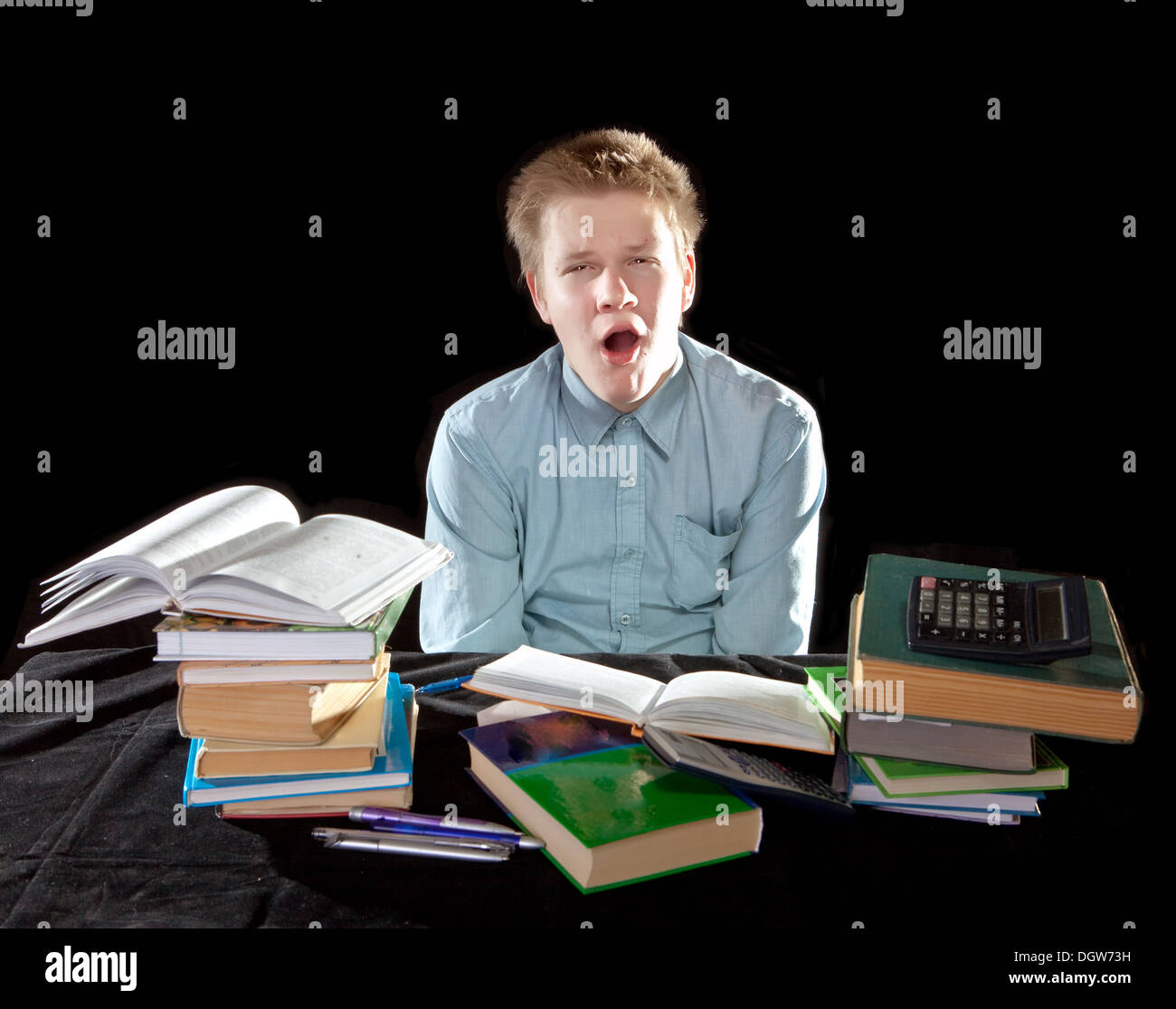 fatigue, the yawning pupil with textbooks Stock Photo