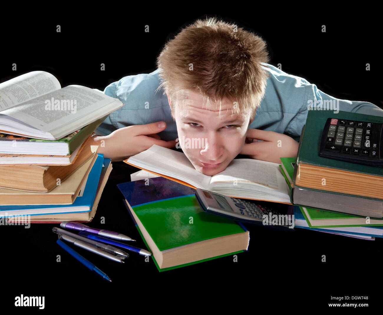 The teenager with a heap of textbooks Stock Photo - Alamy