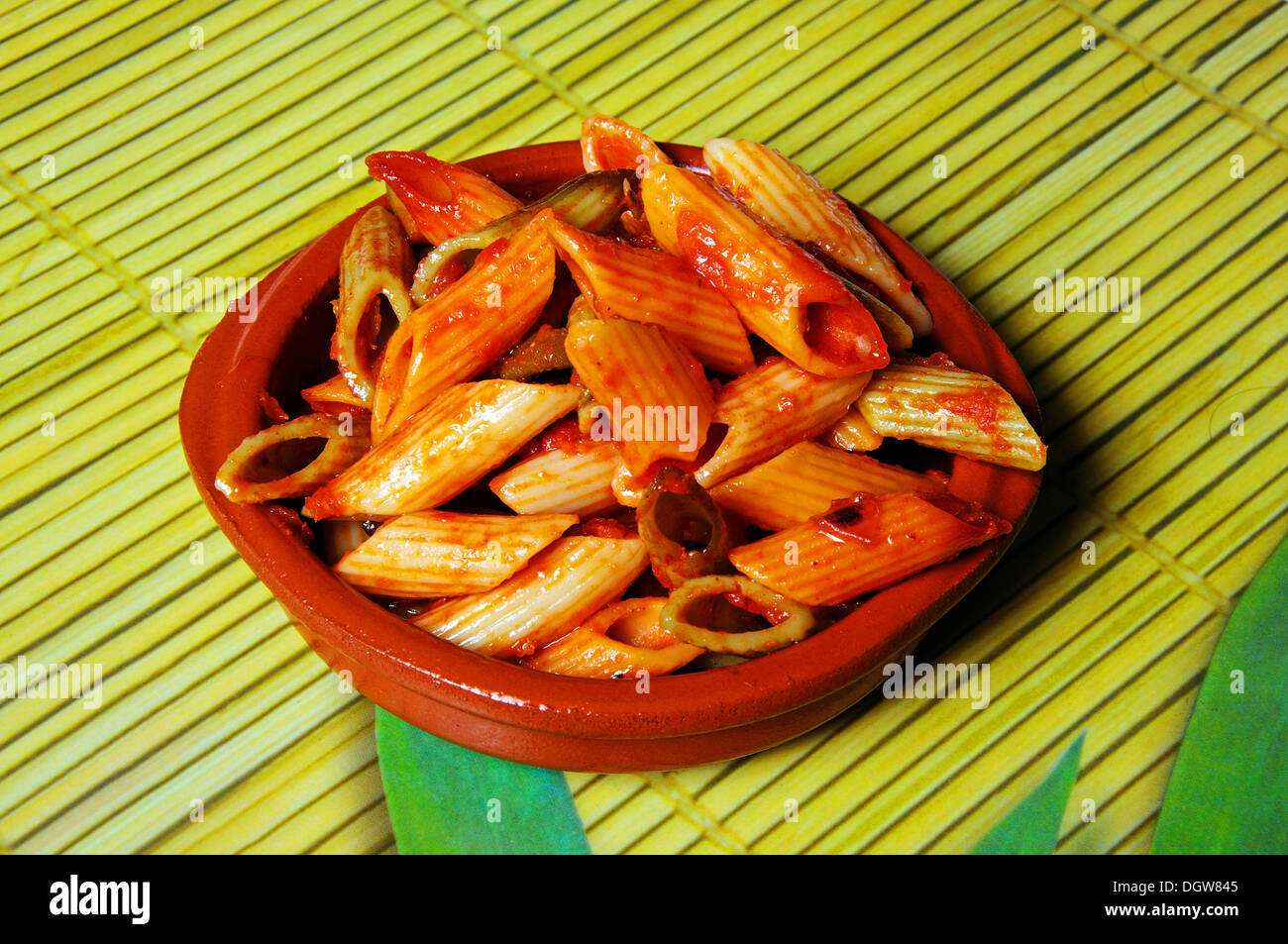 Multicoloured Penne pasta in tomato sauce Stock Photo Alamy