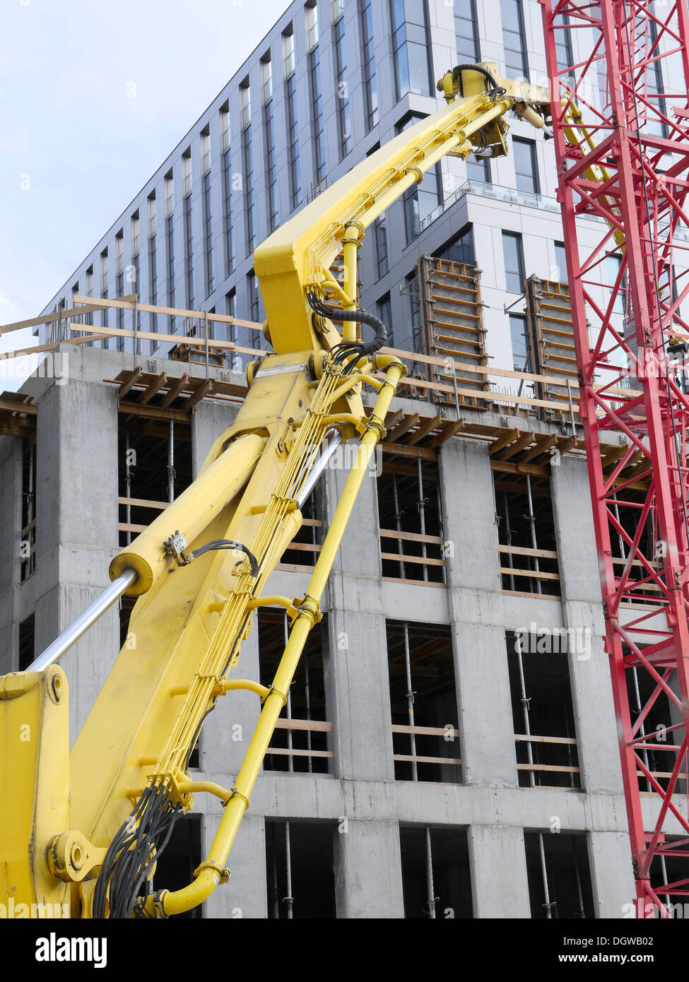 Highrise buildings under construction and yellow ready mix concrete