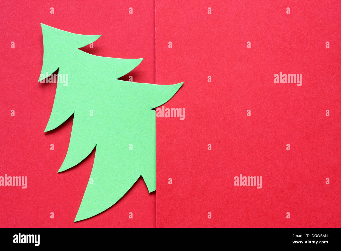 Christmas abstract paper tree on red background Stock Photo - Alamy