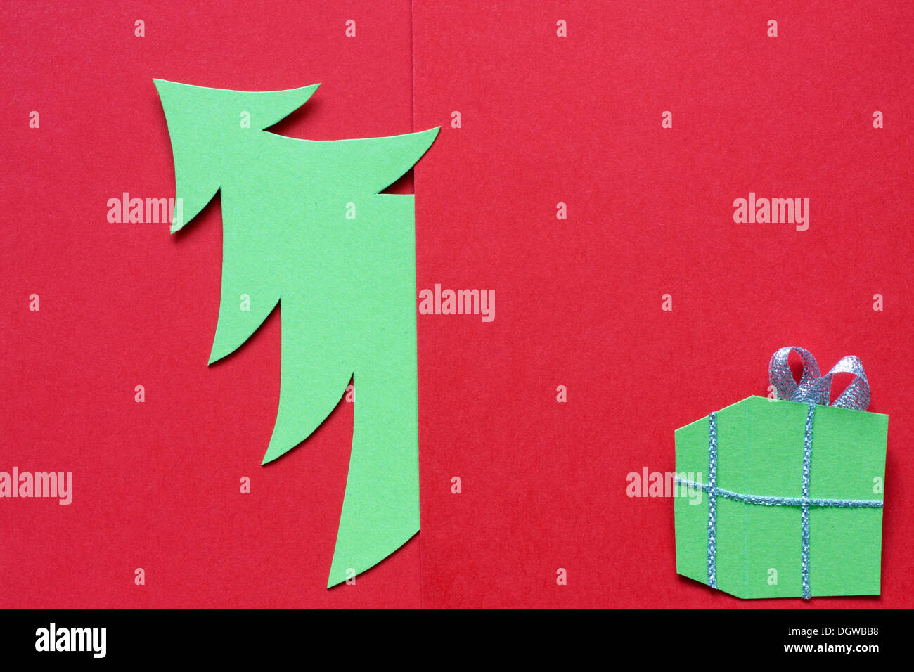 Christmas abstract paper tree on red background Stock Photo - Alamy