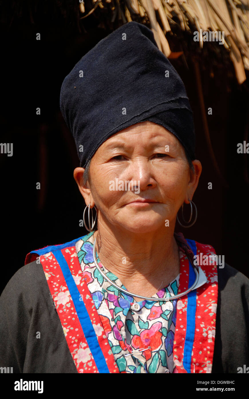 Portrait, woman of the Hmong ethnic group, colorful traditional dress, black headdress, Ban Tan, Phou Den Din National Protected Stock Photo