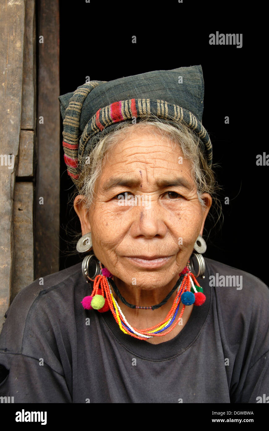 Portrait of an old woman of the Mouchi ethnic group wearing tradtional ...