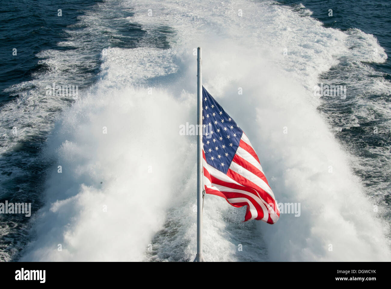 American flag in front of a boats wake, near Bar Harbor, Maine, New