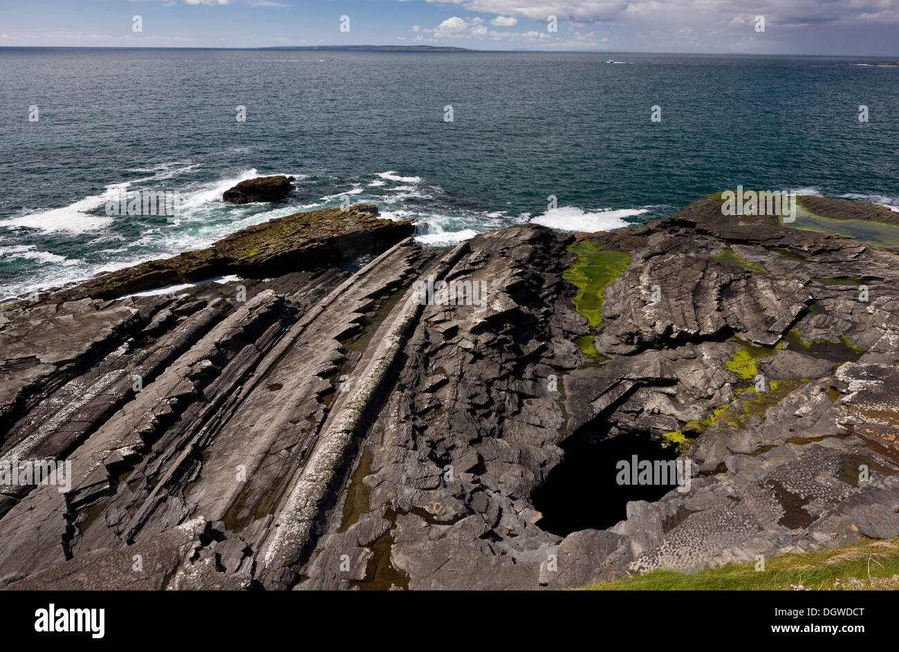 Looking north from cliffs of Moher across the sandstone and siltstone shore towards Doolin and Galway Bay, The Burren, Ireland Stock Photo