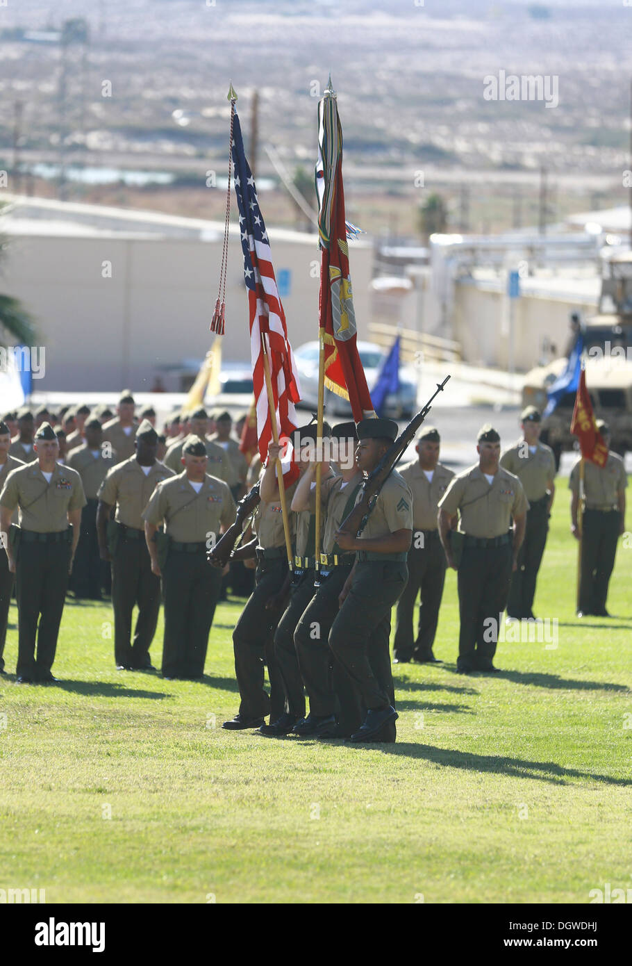 The 7th Marine Regiment color guard marches onto the field during a change of command ceremony at the Lance Cpl. Torrey L. Gray Stock Photo