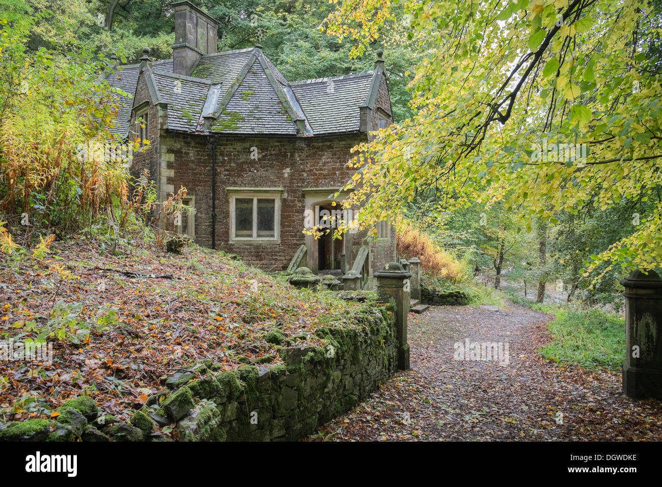 Character building surrounded with autumn coloured foliage, Ilam Park, Derbyshire, England, United Kingdom Stock Photo