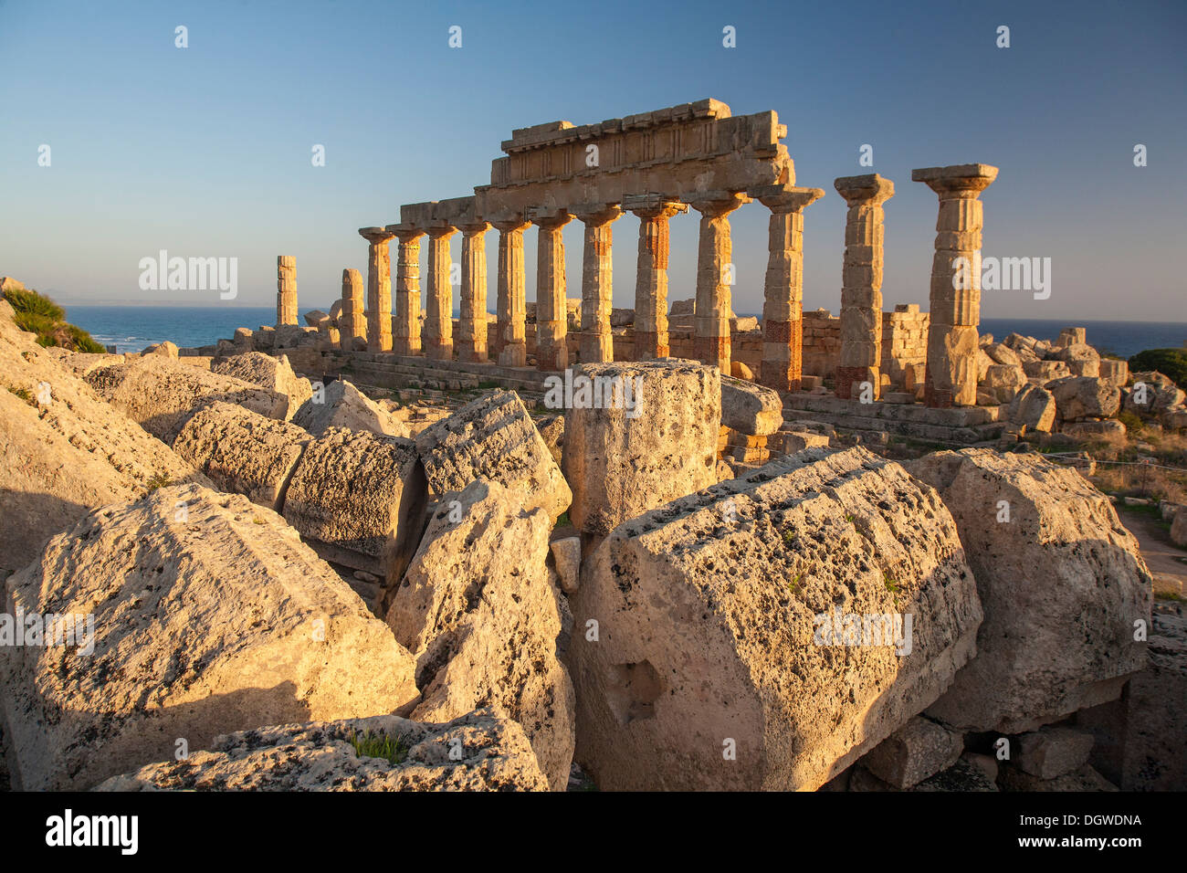 Greek and Roman temple ruins at Selinunte in Sicily.  Rows of stone columns - some in ruins with sections of stone columns in foreground. Stock Photo