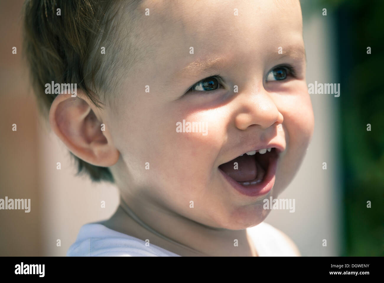 Closeup of happy baby boy face laughing. Stock Photo