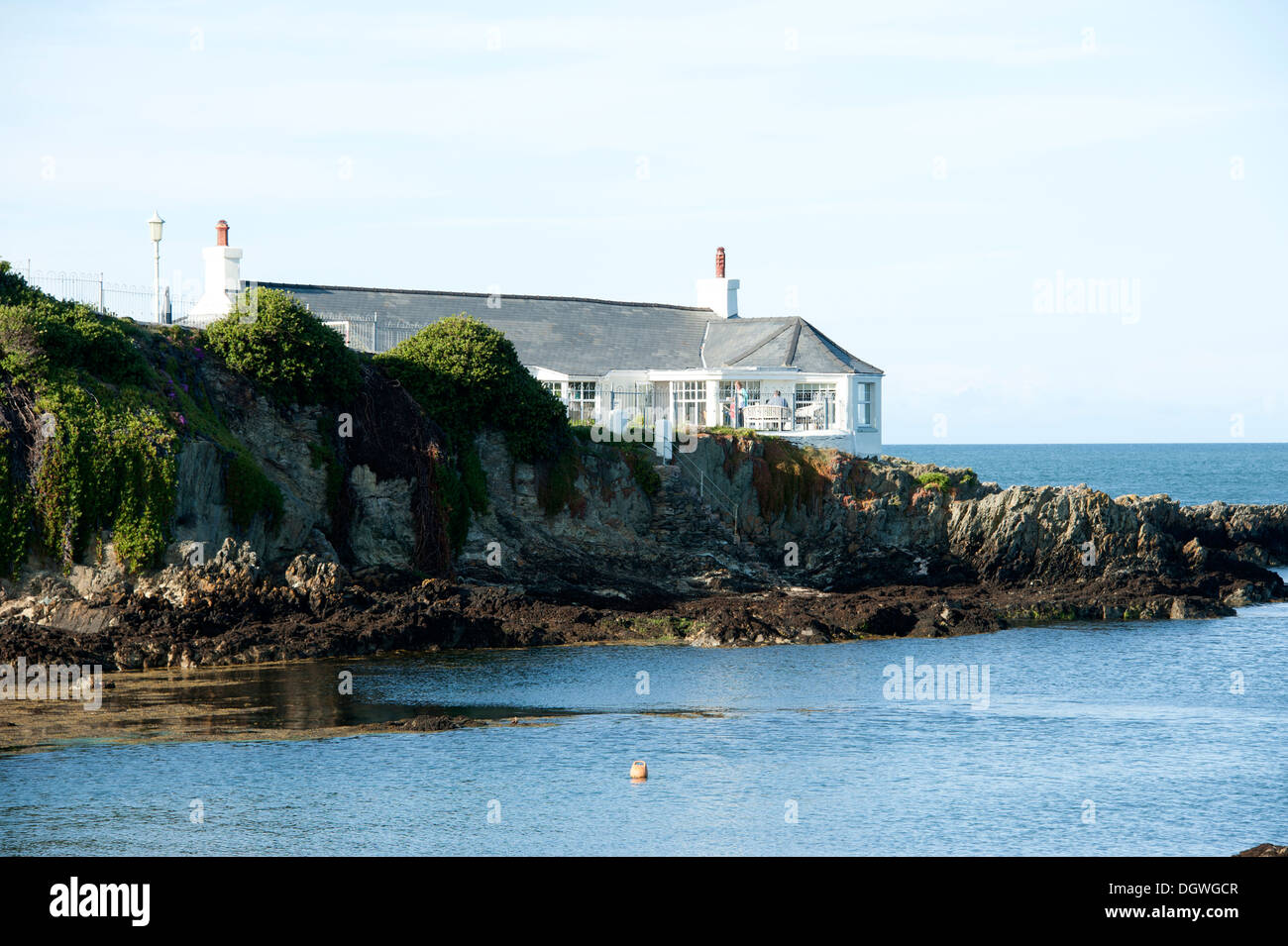 House on rocky outcrop Bull Bay Anglesey North Wales UK Stock Photo