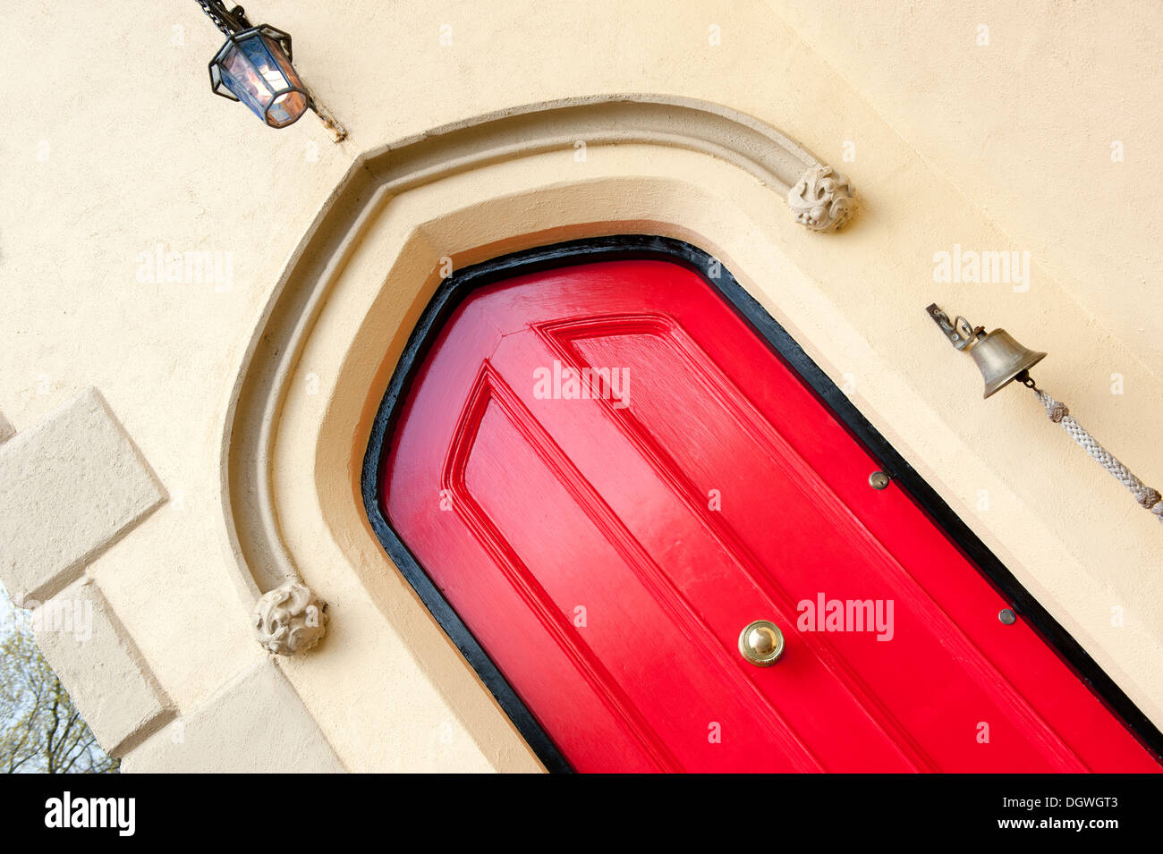 Bright Bold Red Gothic Style House Front Door Stock Photo