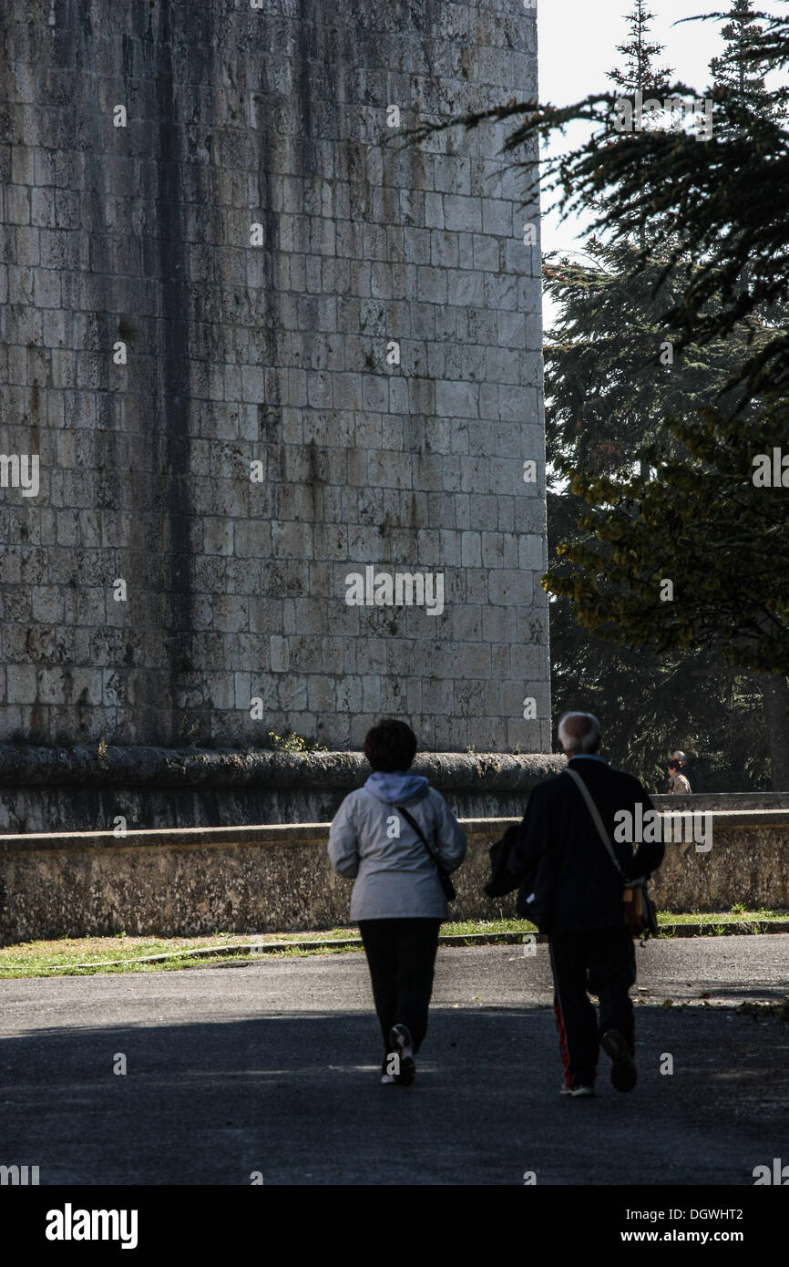 Oct. 26, 2013 - L'Aquila, Italy - People walk on October 25, 2013 in the historic area of L'Aquila, destroyed by an earthquake four years ago, on April 6, 2009. Four years after, the historic center is still abandoned, the reconstruction process is slow outside of commercial premises and the city's churches and monuments are still covered in scaffolding.Photo: Manuel Romano/NurPhoto (Credit Image: © Manuel Romano/NurPhoto/ZUMAPRESS.com) Stock Photo