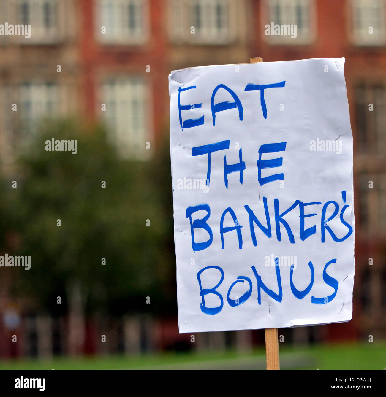 Manchester, UK. 26th Oct, 2013. A poster shows the displeasure of a small anti-Coalition Government group protesting against the bedroom tax and government measures, which are making the life of the ordinary citizen worse than before.  Credit:  John Fryer/Alamy Live News Stock Photo