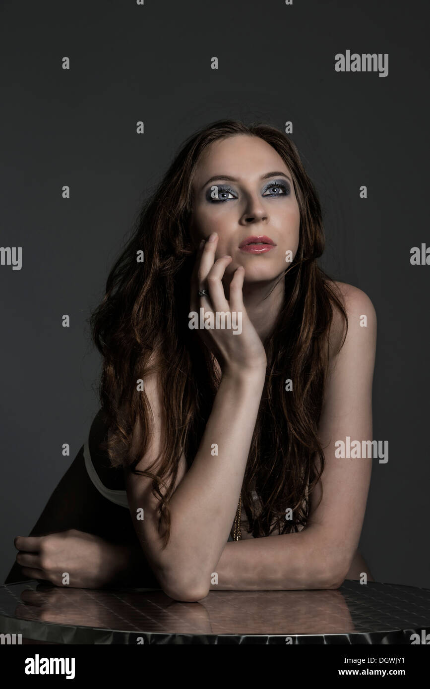 Woman leaning in table hi-res stock photography and images - Alamy