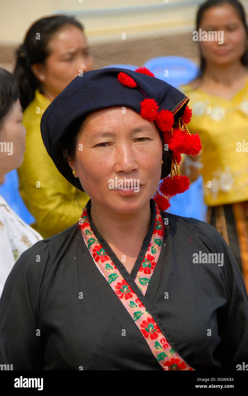 Portrait, woman of the Phunoi ethnicity, traditional clothes, hat with red tassels, Phongsali, Laos, Southeast Asia, Asia Stock Photo