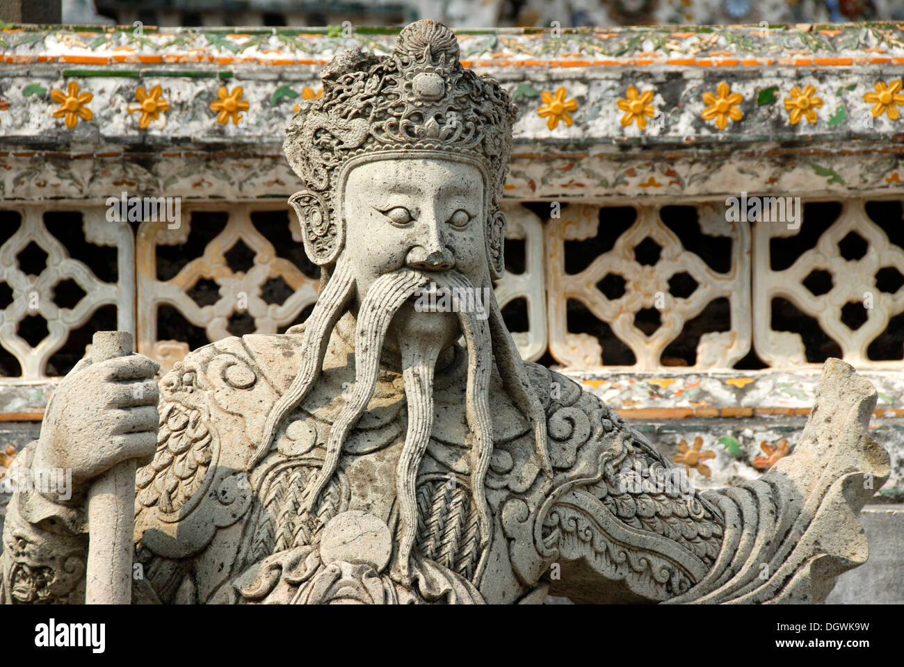 Theravada Buddhism, guard, stone statue of a Chinese warrior, face and long beard, Wat Arun, Bangkok, Thailand, Southeast Asia Stock Photo