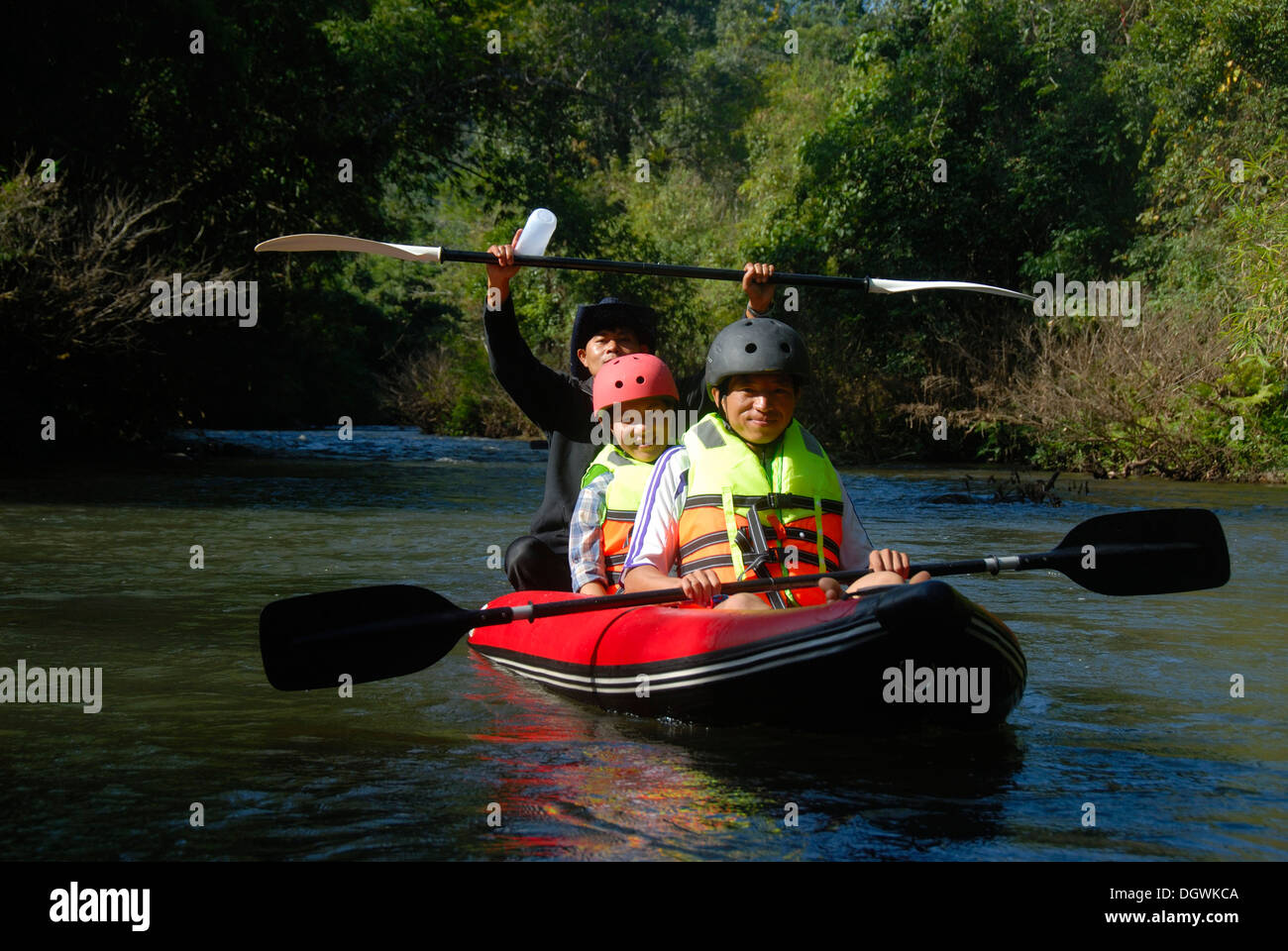 Kayaking, Laotians paddling a kayak on the Nam Ha river, at Namkoy Ban, Nam Ha National Conservation Area, Luang Namtha province Stock Photo