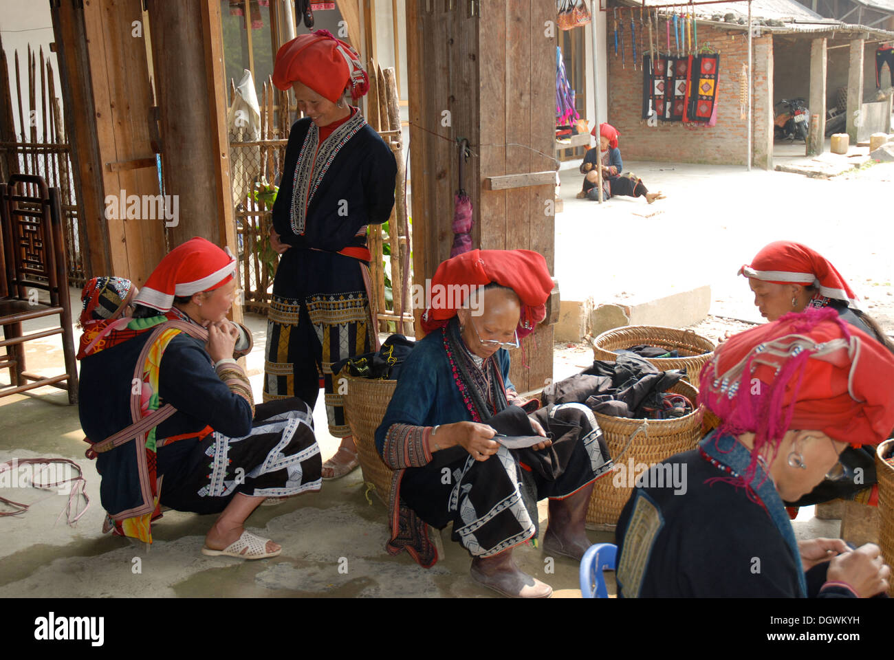 Red dao tribes women prepare their handicrafts for sale in Ta Phin village near Sapa in Vietnam Stock Photo