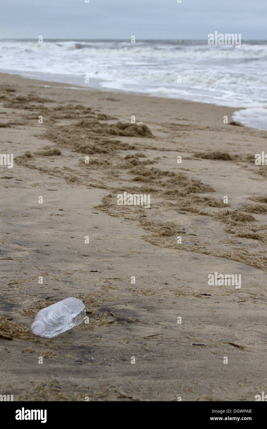 A plastic water bottle washed up onto a beach in Nags Head in the Outer Banks of North Carolina, USA Stock Photo