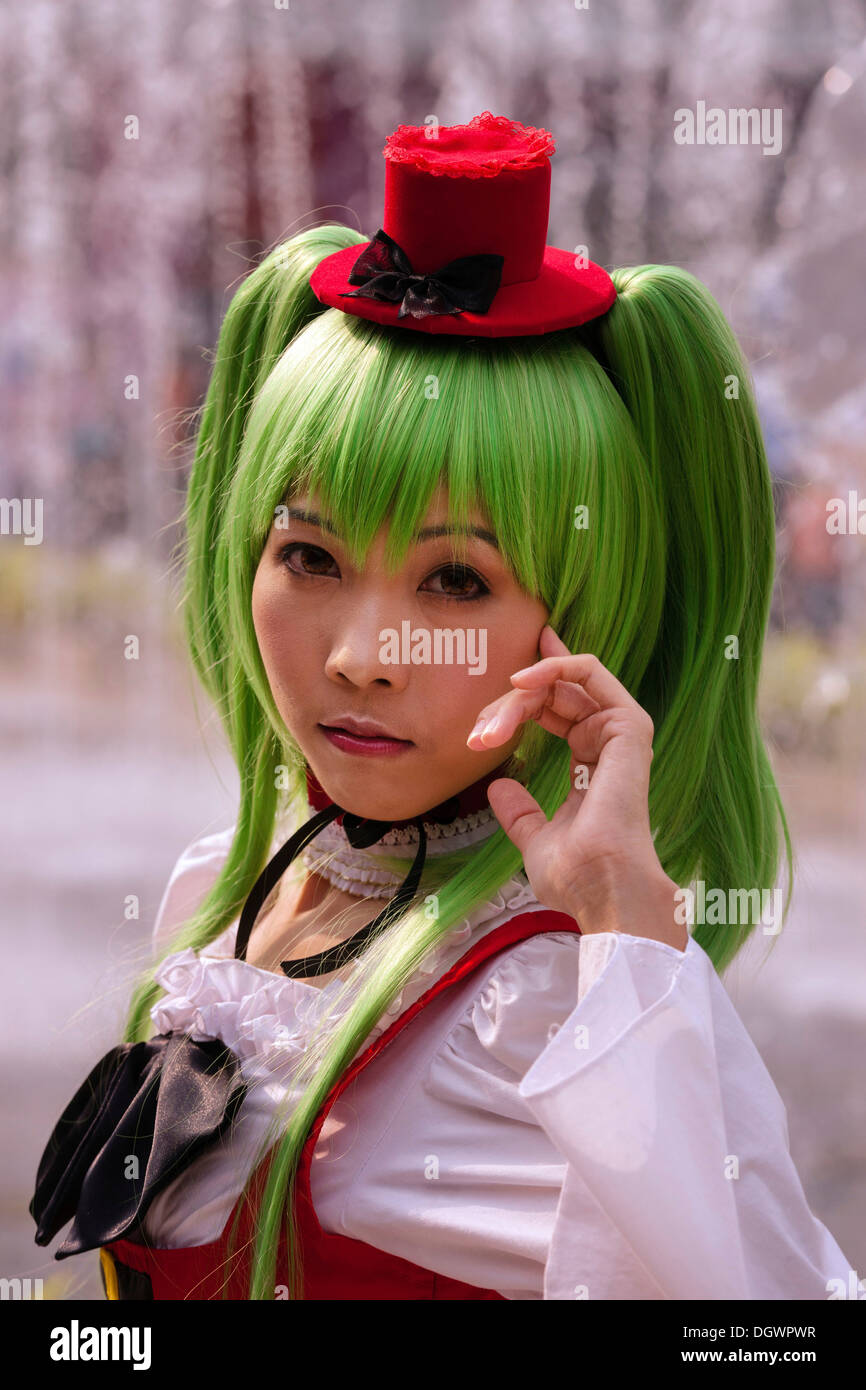 Cosplay, Harajuku, girl with green hair dressed as a Japanese manga character in front of the Siam Paragon shopping centre Stock Photo