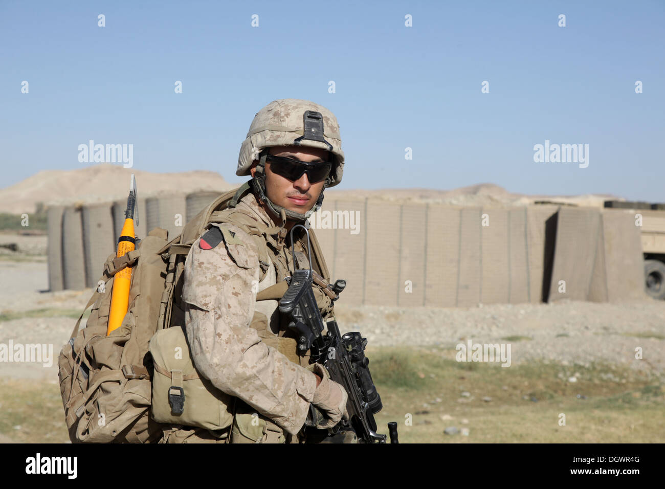 U.S. Marine Corps Lance Cpl. Marco Baro, a rifleman with India Company, 3rd Battalion, 7th Marine Regiment, patrols with his squad near Forward Operating Base Musa Qala, Helmand province, Afghanistan, Oct. 20, 2013. The Marines with 3/7 patrolledled to re Stock Photo