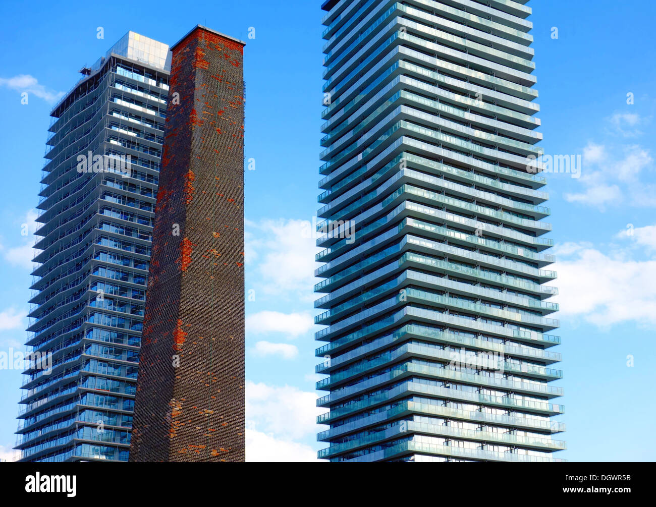 Two modern condo buildings and an old stack pipe in Toronto, Canada Stock Photo