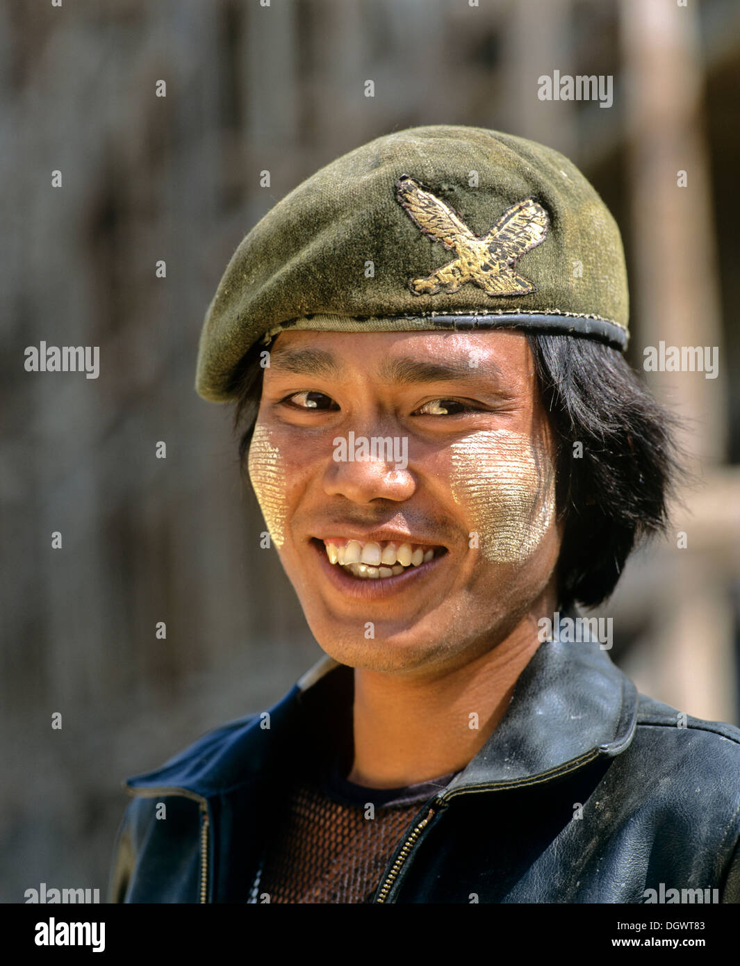 Patriotic young man with thanaka paste on his face, wearing an army cap and a leather jacket, Tachilek, Shan State, Myanmar Stock Photo