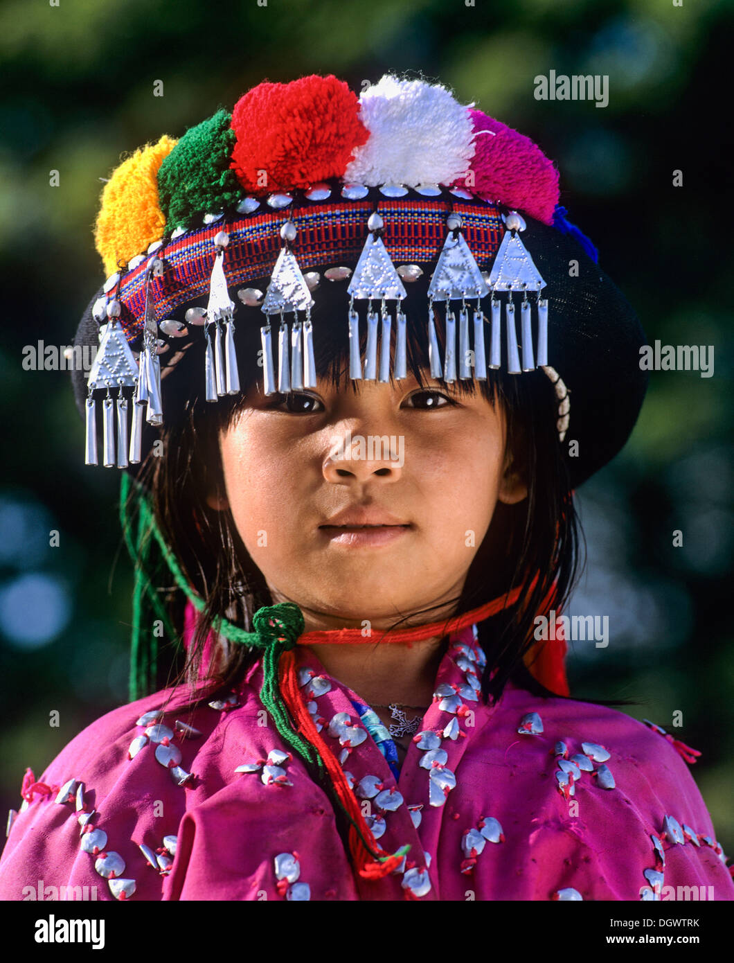 Lisu girl wearing a colourful headdress and the traditional costume of