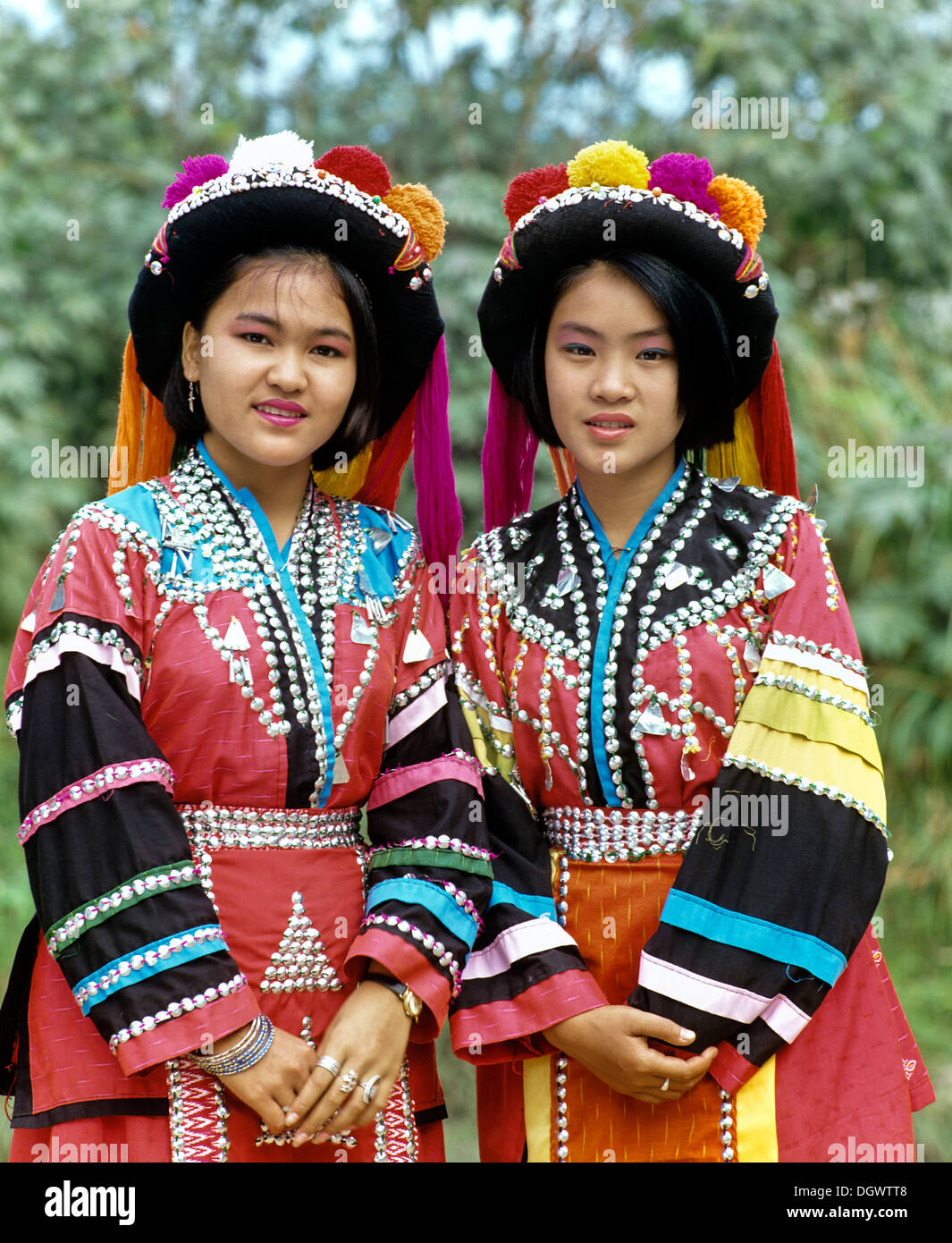Two Lisu girls wearing colourful headdresses and the traditional ...